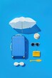 © Pan - Overhead view of travel essentials on vibrant blue background.  White umbrella, blue suitcase, straw hat, sunglasses, yellow purse, and white sunglasses.  Minimalist summer vacation concept