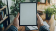 © Ifra - Person holding black tablet iPad   10741
