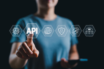 api, application programming interface concept. a person interacts with api icon, representing appli