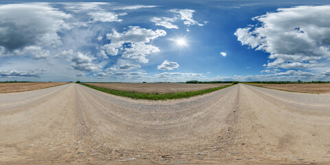 Wall Mural - hdri 360 panorama view on gravel road among fields with clouds in sky in equirectangular full seamle