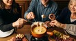 © organik - Gourmet Swiss fondue dinner on a winter evening