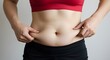 © SITI - Woman Pinching Belly Fat Weight Loss Body Image Health Concern