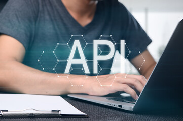 programmer using laptop to create application programming interface