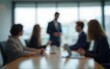 © zhao - blur background of an office meeting with a working group of business people. High quality