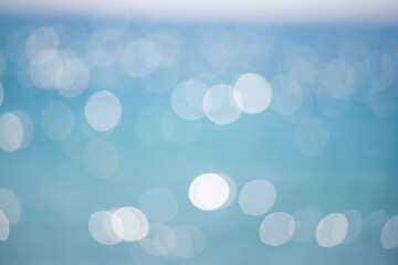 Wall Mural - the image is a blurry blue background with white circles scattered throughout