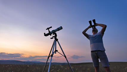 Canvas Print - amateur astronomer using telescope and binoculars for watching stars, moon, planets and other celest