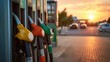 © vetrana - Sunset at the gas station with vibrant pumps and cars parked nearby during evening hours
