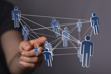 Aufkleber - Image of a hand interacting with a digital network of interconnected people, symbolizing global collaboration and communication.
