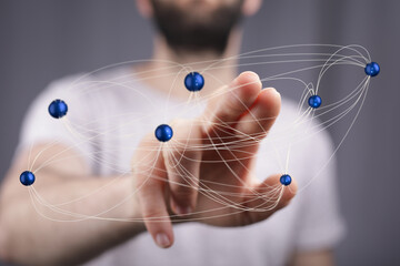 Poster - Man interacts with a digital network, showcasing global connectivity and data flow.