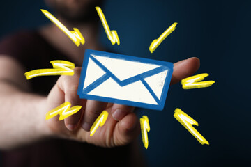 Poster - Hand holding digital email icon.  Concept for online communication, newsletter, inbox.