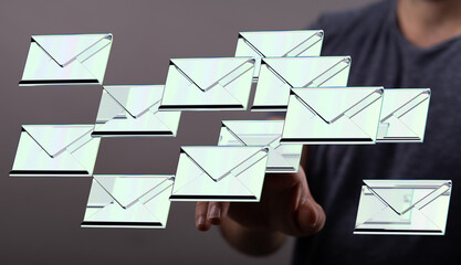 Poster - A hand interacts with a digital display showing many email envelopes, illustrating email management.