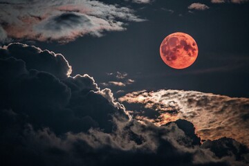 full moon over the clouds