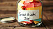 © Abdulloh - Gratitude jar full of colorful notes expressing thankfulness