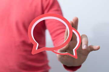 Aufkleber - Image of a person holding two red speech bubbles, perfect for communication concepts.