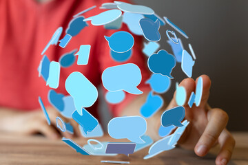 Fototapete - Person interacting with a digital sphere of communication bubbles. Represents social media, online chat, and global communication.