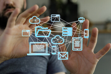 Poster - A man interacts with a visual representation of a digital network, showcasing cloud storage, file sharing, and various devices.