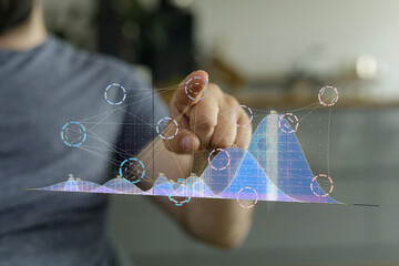 Aufkleber - Close-up of a person's hand interacting with a holographic graph, showcasing data analysis and technology.