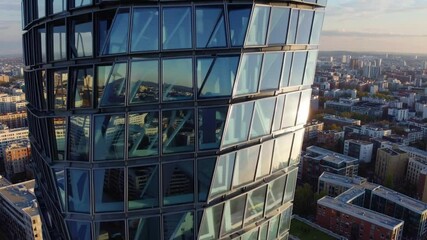 Poster - Futuristic glass architecture modern building cityscape urban reflection and geometric high rise skyscraper with sunlight