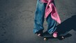 © Anastasiya Ri - Street-style photo of a teenager in wide jeans and pink sneakers balancing on a skateboard ideal for youth fashion lookbooks, urban lifestyle visuals and casual sports promotions
