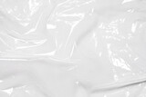 plastic overlay texture of realistic crumpled transparent plastic film wrap on black background,wrinkled stretched plastic effect.
