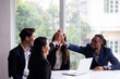 © NVB Stocker - Business team hands together : Unity and teamwork. Company employee celebrate after finishing successful project. Successful people giving each other high five in meeting