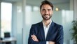© miss irine - Smiling young businessman ceo executive standing in office with crossed arms. Confident pro manager, proud business owner. Successful male in suit. Business career, corporate.