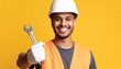 © زين العصر - Smiling tradesman holds wrench ready for work