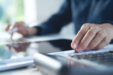 Wall Mural - close up, business woman working on laptop computer with digital tablet on office desk, surfing the 
