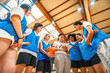 © unai - Female basketball coach explaining game strategy to team
