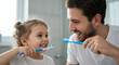 © keran studio - Happy family brushing teeth together
