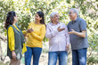 © G-images - Group of indian senior male and woman friends At park