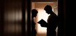 © Thee - Silhouettes of a couple sharing an intimate moment while reading in a softly lit room, evoking deep connections.