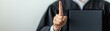 © Enjoy - A judge wearing traditional robe holding a document while raising a finger up