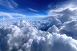 © YouraPechkin - Expansive view of fluffy clouds under a bright blue sky from high altitude