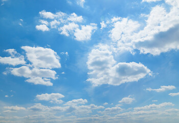 Wall Mural - a beautiful blue sky with soft white clouds for abstract background