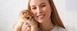 © Pixel-Shot - Young woman with cute kitten at home, closeup