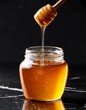 © saratm - Honey jar with honey spill on black marble table. Generated image