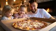 © vachiraphan - Joyful Moment of Man and Little Girl Sharing Excitement over Pizza