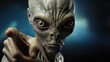 © LoomStock - Alien with green eyes pointing on dark background. Humanoid. Alien. Sci Fi Concept With Copy Space.