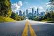 © Shelley - Empty asphalt road leading toward Atlanta city skyline with modern skyscrapers in the background, urban landscape on a clear day.