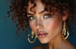 © Viktor - Beautiful model flawless makeup curly hair with gold jewelry on dark blue background. Fashionable woman, portrait, makeup, beauty, cosmetic, hair, skincare, accessory, jewellery, shop, advertising,