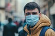 © Web - Young Professionals in Modern Startup Environment with Masks - Embracing Social Distance in the Workplace during the Coronavirus Pandemic