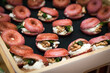 © Austockphoto - Tray of mini beetroot donuts and filling