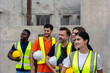 © Ron - Civil engineers from different cultures stand to support a women supervisor for her leadership in a factory. Women leadership in a construction factory