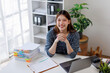 © David - Image of happy young Asian business woman working document and laptop at office