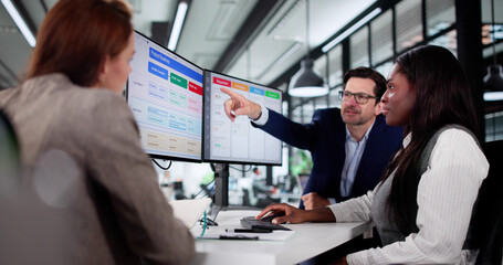 Wall Mural - multiracial manager uses kanban software on laptop