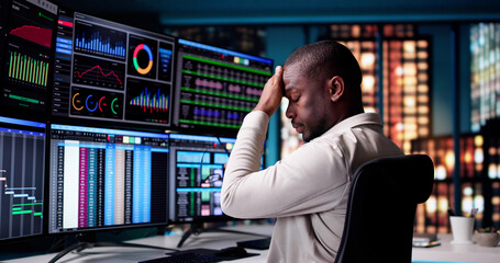 Wall Mural - exhausted african american businessman working late
