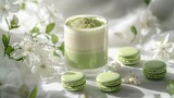 Refreshing matcha latte and delicate macarons on a light background.