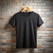 © tong4130 - Black t shirt hanging against brick wall with warm light