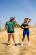 © Mandy - Two women stretching neck muscles during outdoor workout in summer